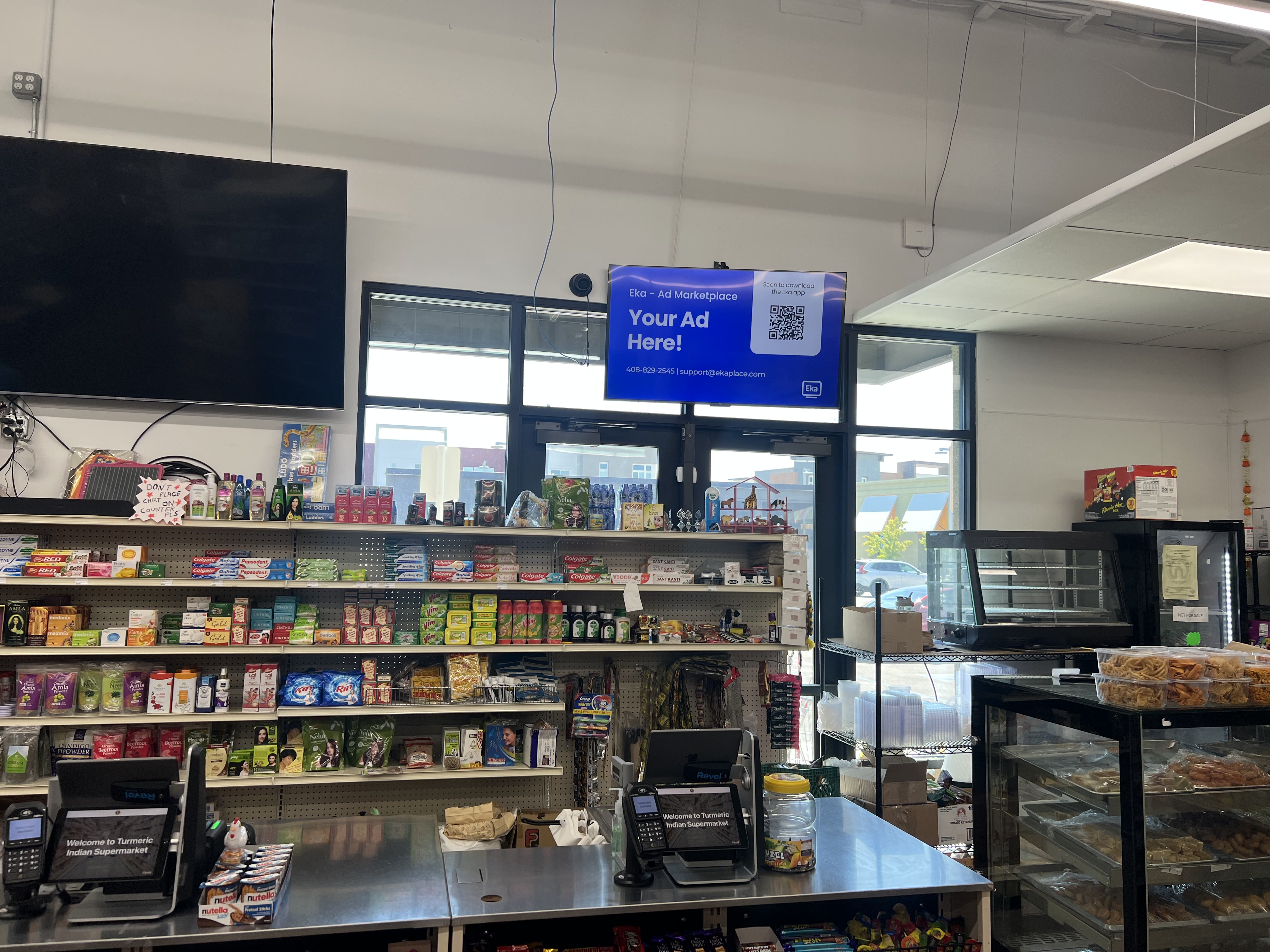 Eka digital screen running inside Turmeric Indian grocery store in Dublin, CA
